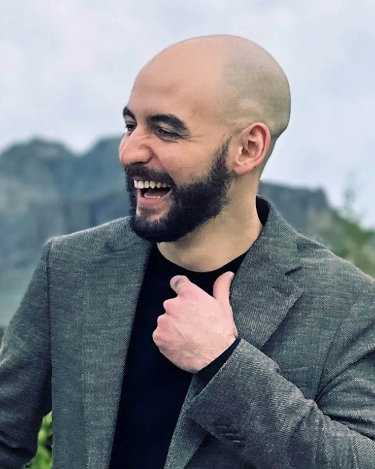 Deniz Akman smiling outdoors