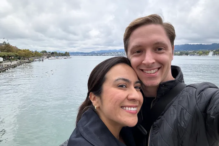 Mark and Vivian smiling together beside Lake Zurich in Switzerland